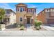 Charming two-story home featuring manicured landscaping and a welcoming front porch at 992 Wagner Valley St, Henderson, NV 89052