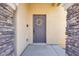 Close-up of the front door with stone pillars and a decorative wreath at 992 Wagner Valley St, Henderson, NV 89052