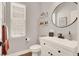 Stylish half bath featuring modern fixtures, elegant finishes, and natural light at 992 Wagner Valley St, Henderson, NV 89052