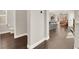Open-concept hallway leading to the kitchen, living area, and downstairs half bath at 992 Wagner Valley St, Henderson, NV 89052