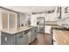 Modern kitchen with granite countertops, stainless steel appliances, and a large island with a sink at 992 Wagner Valley St, Henderson, NV 89052