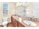 Bathroom with double sink vanity, granite countertop, and tiled shower at 1 Corte Belleza, Henderson, NV 89011