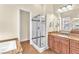 Elegant bathroom with a glass-enclosed shower and granite countertops at 1 Corte Belleza, Henderson, NV 89011