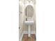 Powder room with pedestal sink and decorative mirror at 1 Corte Belleza, Henderson, NV 89011