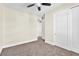Spacious bedroom with neutral carpet, closet, and adjoining hallway at 1 Corte Belleza, Henderson, NV 89011