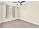 Bedroom with neutral carpet, ceiling fan, and window with curtains at 1 Corte Belleza, Henderson, NV 89011
