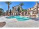 Inviting community pool with poolside cabanas, landscaping, and barbecue area at 1 Corte Belleza, Henderson, NV 89011
