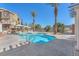 Resort-style community pool area featuring comfortable lounge seating and lush landscaping at 1 Corte Belleza, Henderson, NV 89011