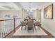 Elegant dining room with contemporary furnishings and plenty of natural light at 1 Corte Belleza, Henderson, NV 89011