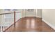 Second floor hallway with wood flooring and natural light at 1 Corte Belleza, Henderson, NV 89011