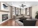 Cozy living room featuring a fireplace, hardwood floors, and comfortable seating at 1 Corte Belleza, Henderson, NV 89011