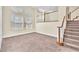 Open-concept living space with staircase at 1 Corte Belleza, Henderson, NV 89011