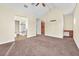Large main bedroom featuring carpeted floors and access to bathroom and walk in closet at 1 Corte Belleza, Henderson, NV 89011