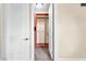 Walk-in closet featuring wooden shelves and custom drawer systems, and access to the main bedroom at 1 Corte Belleza, Henderson, NV 89011