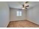 Cozy bedroom featuring neutral carpet, ceiling fan, and a window with shutter blinds at 10009 Netherton Dr, Las Vegas, NV 89134