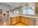 Eat-in kitchen features granite countertops, wood cabinets, and stainless appliances at 10009 Netherton Dr, Las Vegas, NV 89134