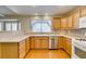 Eat-in kitchen with countertops, oak cabinetry, and stainless steel appliances at 10009 Netherton Dr, Las Vegas, NV 89134
