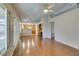 Spacious living room featuring wood floors, bright lighting, and access to the kitchen at 10009 Netherton Dr, Las Vegas, NV 89134