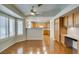 Bright living space featuring plantation shutters and a view of the kitchen at 10009 Netherton Dr, Las Vegas, NV 89134