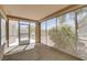 Enclosed patio featuring a screened-in design and views of the landscape at 10009 Netherton Dr, Las Vegas, NV 89134