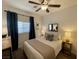 Inviting bedroom with a cozy bed, stylish decor, and ample natural light at 1018 Snow Bunting Ct, Henderson, NV 89002