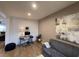 Comfortable living room with hardwood floors, gray couch, and a modern art piece at 1018 Snow Bunting Ct, Henderson, NV 89002