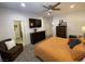Main bedroom suite with ceiling fan, carpet flooring, and ensuite bathroom at 1018 Snow Bunting Ct, Henderson, NV 89002