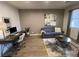 Office space featuring a comfortable couch, desk, and stylish decor at 1018 Snow Bunting Ct, Henderson, NV 89002