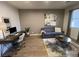Office space featuring a comfortable couch, desk, and stylish decor at 1018 Snow Bunting Ct, Henderson, NV 89002