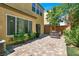 Spacious backyard featuring pavers and mature shrubbery at 10230 Danskin Dr, Las Vegas, NV 89166