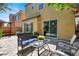Relaxing backyard with an outdoor seating area and sliding glass doors at 10230 Danskin Dr, Las Vegas, NV 89166
