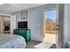 Bedroom boasts an open door to a patio with outdoor access at 10230 Danskin Dr, Las Vegas, NV 89166