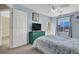 Comfortable bedroom with light blue walls and a vintage green dresser at 10230 Danskin Dr, Las Vegas, NV 89166