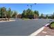 Gated entrance to a secure community featuring decorative landscaping at 10230 Danskin Dr, Las Vegas, NV 89166