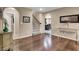 Bright and spacious living room featuring hardwood floors and staircase to upper level at 10230 Danskin Dr, Las Vegas, NV 89166