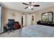 Spacious main bedroom with a ceiling fan and a desk provides a nice workspace at 10230 Danskin Dr, Las Vegas, NV 89166