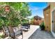 Cozy patio with stone pavers, outdoor furniture and privacy landscaping at 10230 Danskin Dr, Las Vegas, NV 89166