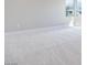 Bright bedroom with soft, neutral carpeting and large window offering plenty of natural light at 10433 Smokey Mariposa Ave, Las Vegas, NV 89166
