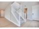 View of an open concept entryway featuring stairs, wood flooring, and natural light at 10433 Smokey Mariposa Ave, Las Vegas, NV 89166