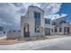 View of a modern two-story home, front gate, and tidy desert landscaping at 10433 Smokey Mariposa Ave, Las Vegas, NV 89166