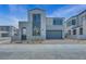 Contemporary two-story home with a modern design, neat landscaping, and a two car garage at 10433 Smokey Mariposa Ave, Las Vegas, NV 89166