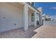 Covered paver patio of a modern two-story home at 10433 Smokey Mariposa Ave, Las Vegas, NV 89166