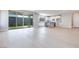 Open concept living room and kitchen area with wood floors and bright natural light at 10433 Smokey Mariposa Ave, Las Vegas, NV 89166