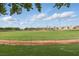 Baseball field at The Crossing Park, featuring well-kept grass and fencing at 10540 Beachwalk Pl, Las Vegas, NV 89144