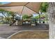 Playground at The Crossing Park with a shaded structure and play equipment at 10540 Beachwalk Pl, Las Vegas, NV 89144