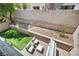 Aerial view of a backyard featuring a quaint patio and easy-care desert landscaping at 11908 Menchaca Ln, Las Vegas, NV 89138