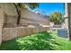 Expansive backyard featuring a turfed area, desert landscaping, and a cozy outdoor seating area at 11908 Menchaca Ln, Las Vegas, NV 89138