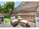 Outdoor patio featuring cushioned wicker seating, offering a cozy space for relaxation at 11908 Menchaca Ln, Las Vegas, NV 89138