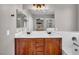 Bathroom featuring double sinks, vanity, bathtub and shower combination at 11908 Menchaca Ln, Las Vegas, NV 89138