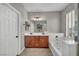 Bathroom features double sinks, vanity, bathtub, and tile flooring at 11908 Menchaca Ln, Las Vegas, NV 89138